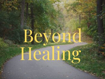 A sunlit path lined with trees, softly out of focus with word Beyond Healing centered.