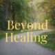 A sunlit path lined with trees, softly out of focus with word Beyond Healing centered.
